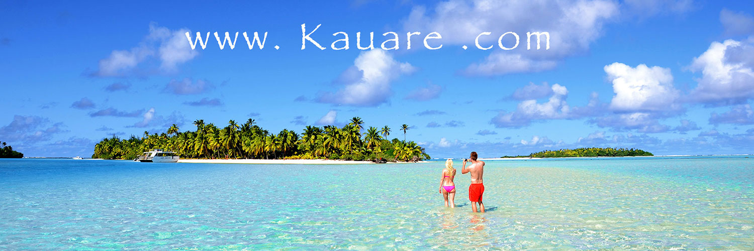 Couple walking in turquoise lagoon on Aitutaki Island