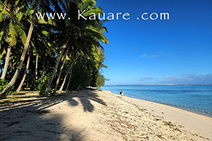 a guest of Kuarae lodge walking along the Beach on Rarotonga