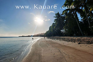 early morning swimmers on the beach at south rarotonga
