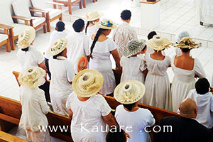 ladies attending church wearing white hats and dress
